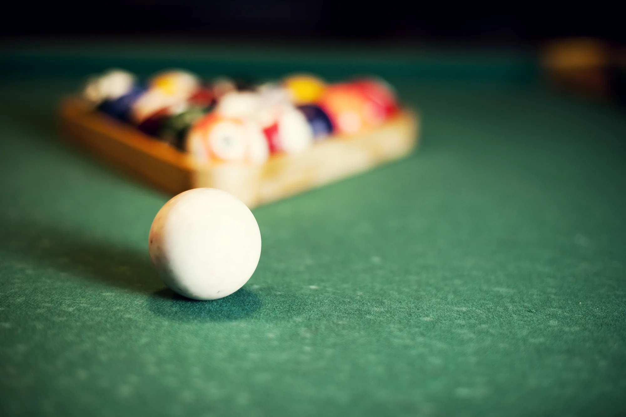Pool balls on a green table at Mr Cue’s Pool Bar